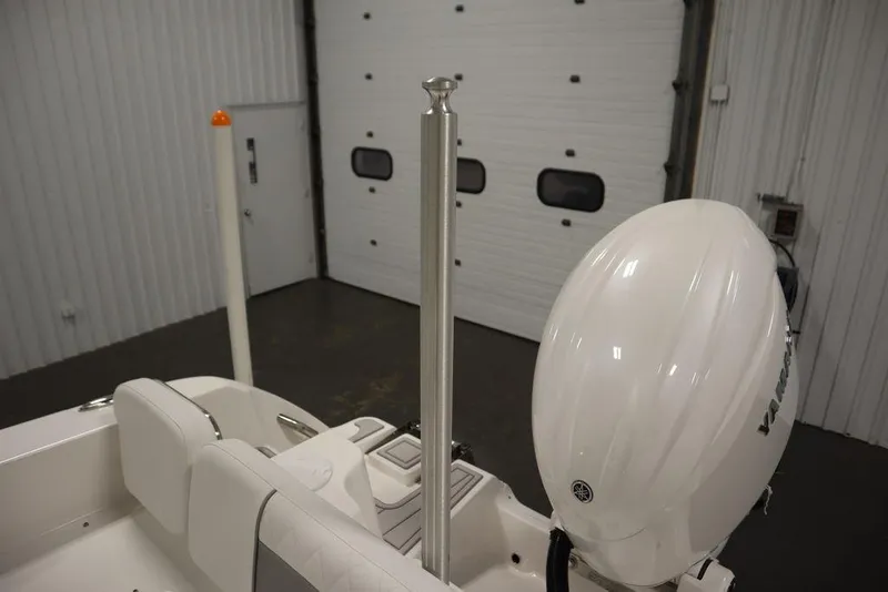 Slide: The Image of 2025 Sea Fox 228 Commander boat with Yamaha outboard motor in a garage. - 41