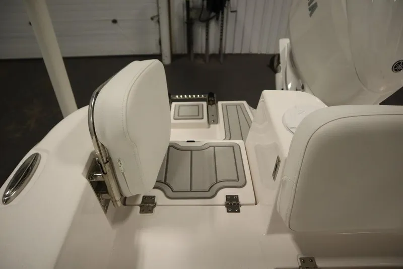 Slide: The Image of 2025 Sea Fox 228 Commander boat interior with white seating and storage compartments. - 43