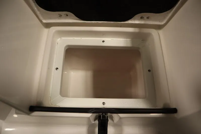Slide: The Image of 2025 Sea Fox 228 Commander storage compartment, open and empty. - 45