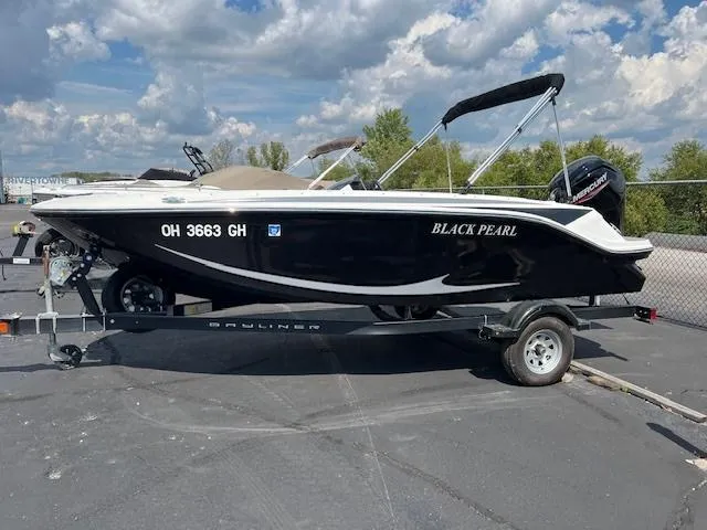 Slide: The Image of 2022 Bayliner Element M17 boat on trailer, named "Black Pearl," under a cloudy sky. - 2