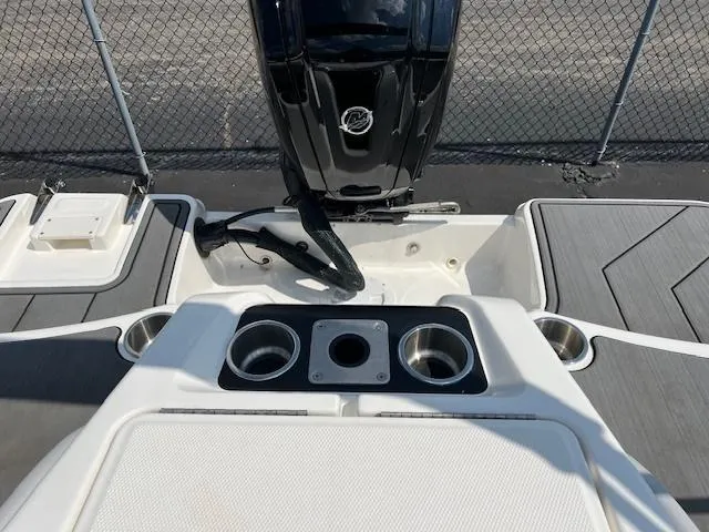 Slide: The Image of 2022 Bayliner Element M17 boat stern with motor and cup holders. - 9