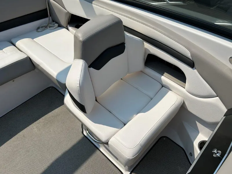 Slide: The Image of 2017 Four Winns H210 boat interior with sleek white and gray seating. - 10