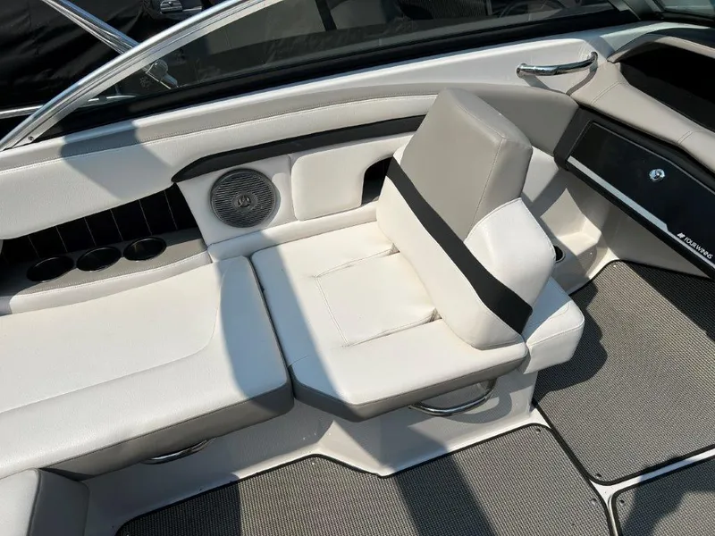 Slide: The Image of 2017 Four Winns H210 boat interior with gray seating and cup holders. - 11