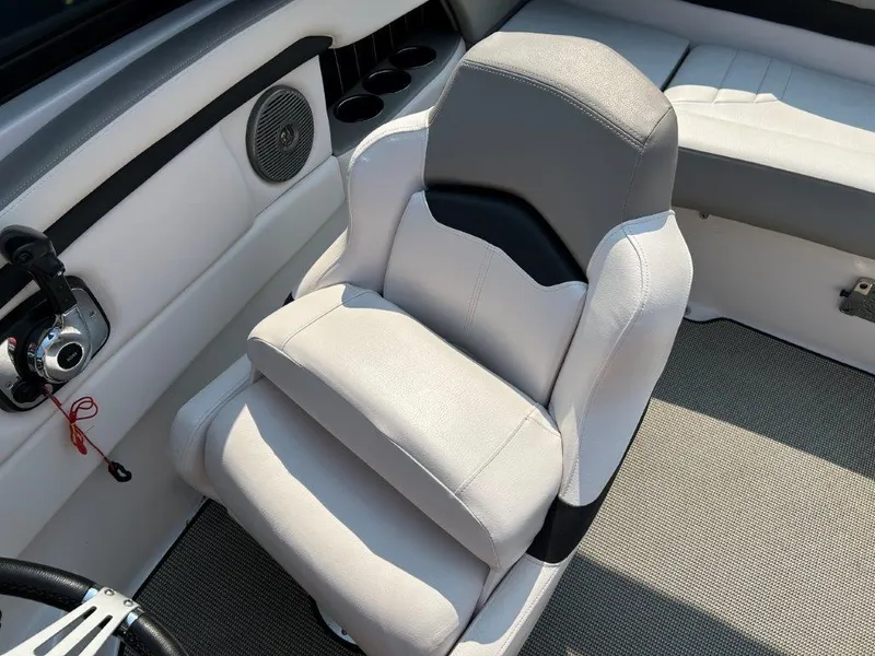 Slide: The Image of 2017 Four Winns H210 boat interior with cushioned seating and speaker system. - 8