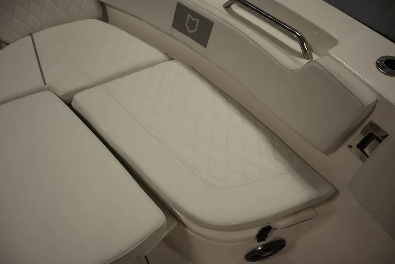 Slide: The Image of Luxurious seating on 2025 Sea Fox 248 Commander boat, featuring quilted white upholstery. - 16