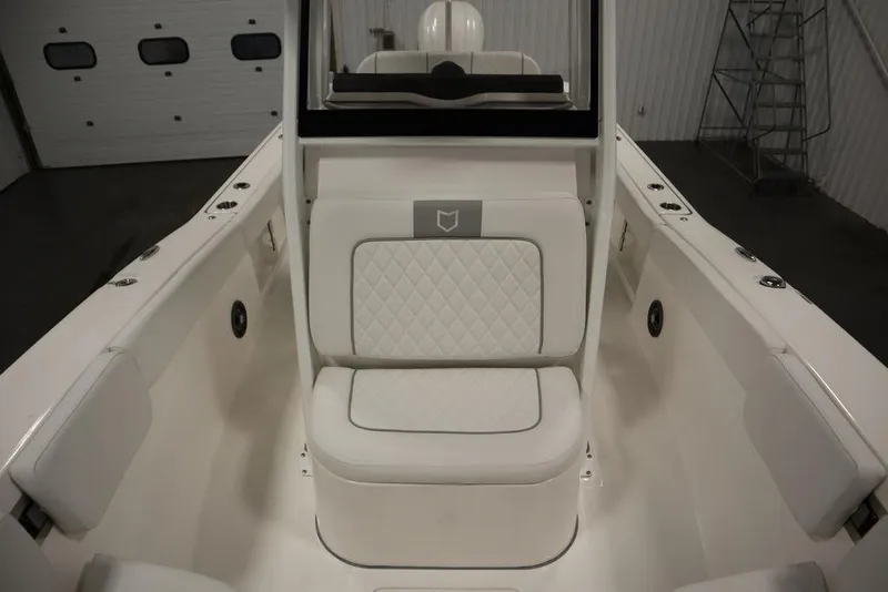 Slide: The Image of 2025 Sea Fox 248 Commander boat interior with white cushioned seating. - 20