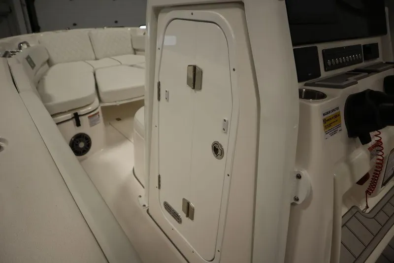 Slide: The Image of 2025 Sea Fox 248 Commander boat interior with seating and storage compartment. - 21