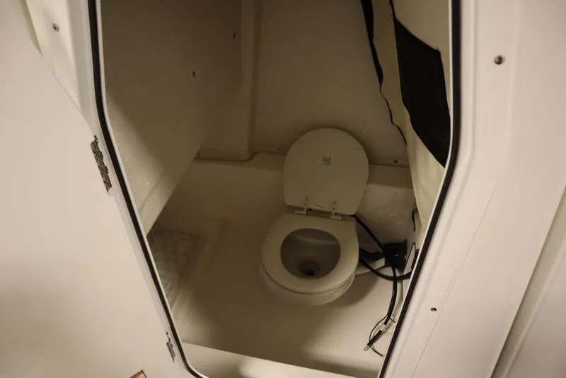 Slide: The Image of Interior view of a 2025 Sea Fox 248 Commander boat's compact bathroom. - 22