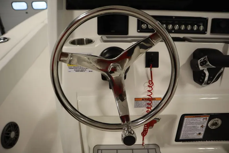 Slide: The Image of Steering wheel of 2025 Sea Fox 248 Commander boat, featuring modern controls and dashboard. - 24