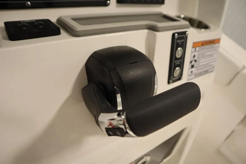Slide: The Image of Throttle control of 2025 Sea Fox 248 Commander boat, featuring sleek design and ergonomic handle. - 29