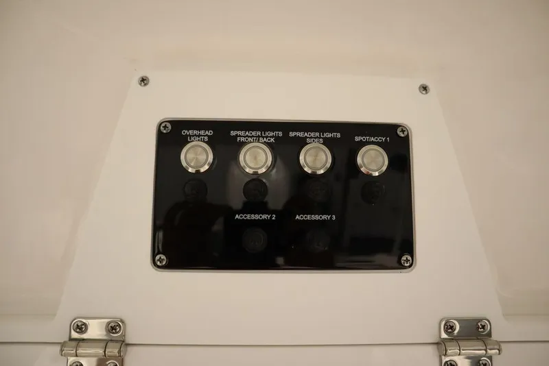 Slide: The Image of Control panel of 2025 Sea Fox 248 Commander boat with labeled switches. - 36