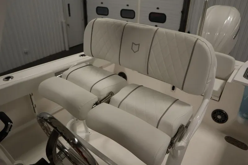 Slide: The Image of 2025 Sea Fox 248 Commander boat interior with white cushioned seating. - 38