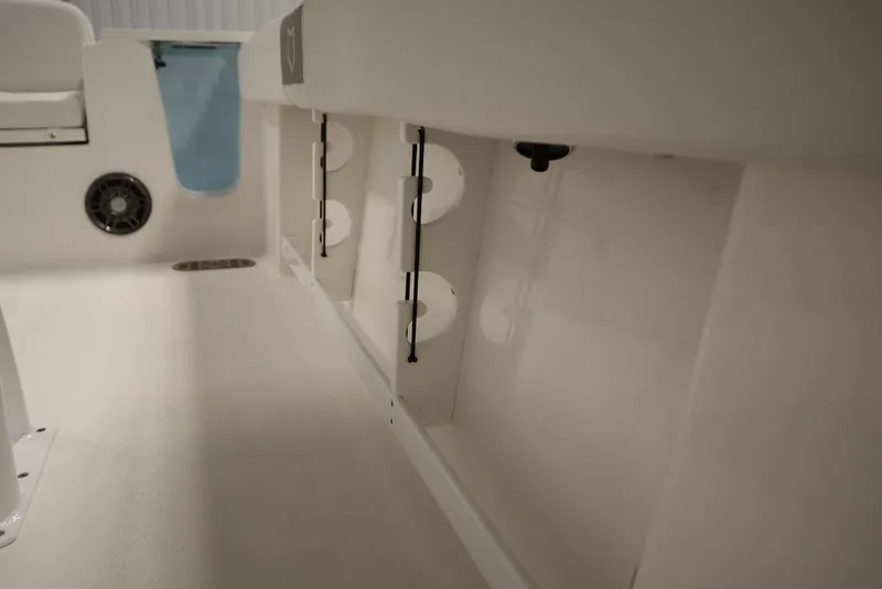 Slide: The Image of Interior view of 2025 Sea Fox 248 Commander boat, showcasing storage compartments and seating area. - 40