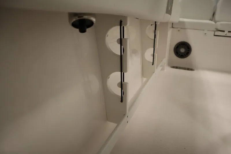 Slide: The Image of 2025 Sea Fox 248 Commander interior storage compartment with rod holders. - 41