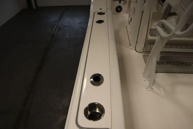 Slide: The Image of 2025 Sea Fox 248 Commander boat interior with cup holders and seating area. - 42