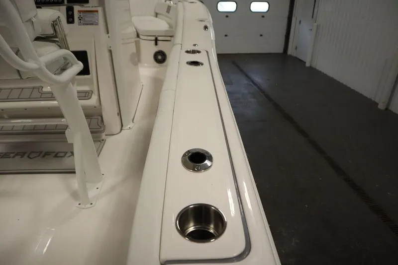 Slide: The Image of 2025 Sea Fox 248 Commander boat interior with cup holders and seating. - 43