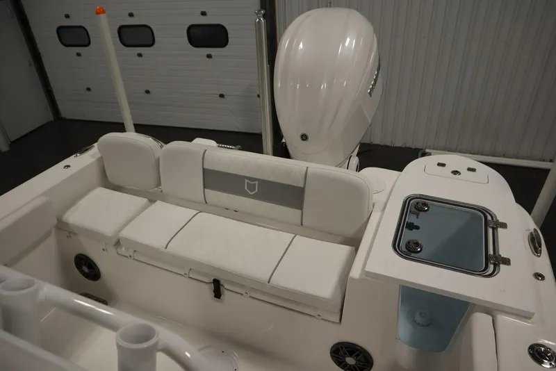 Slide: The Image of 2025 Sea Fox 248 Commander boat interior with seating and motor. - 44