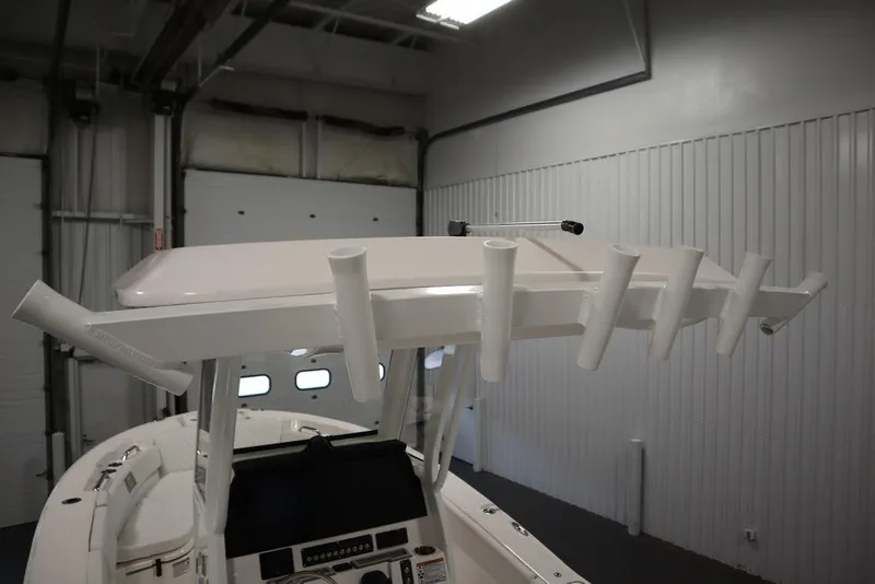 Slide: The Image of 2025 Sea Fox 248 Commander boat with rod holders in a garage. - 47