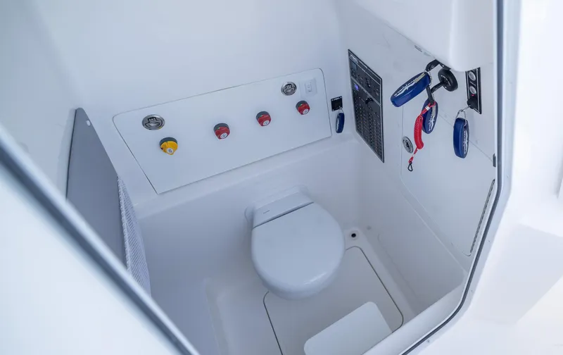 Slide: The Image of 2025 Invincible 33 Open Fisherman boat interior with modern marine toilet. - 17