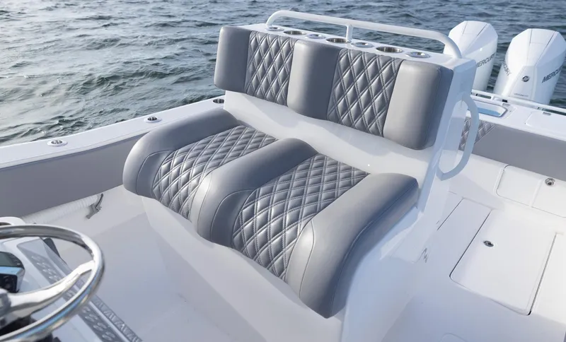 Slide: The Image of 2025 Invincible 33 Open Fisherman boat with luxurious quilted seating on open water. - 18
