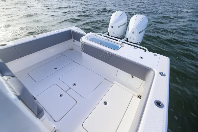 Slide: The Image of 2025 Invincible 33 Open Fisherman boat with twin engines on the water. - 23