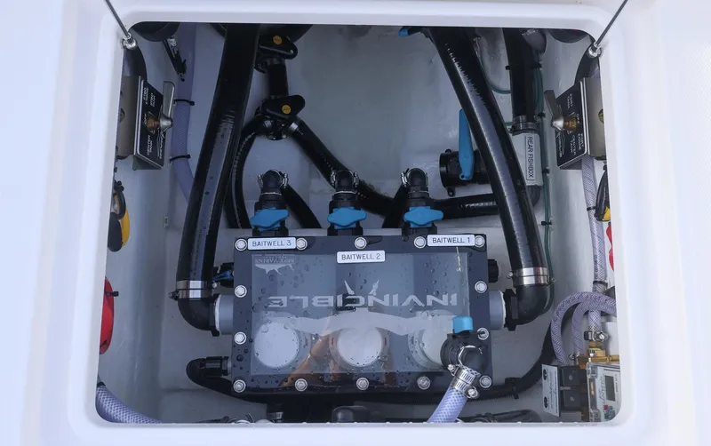 Slide: The Image of 2025 Invincible 33 Open Fisherman boat plumbing system with labeled valves and hoses. - 25