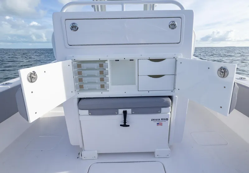 Slide: The Image of 2025 Invincible 33 Open Fisherman boat storage compartments open on deck. - 27