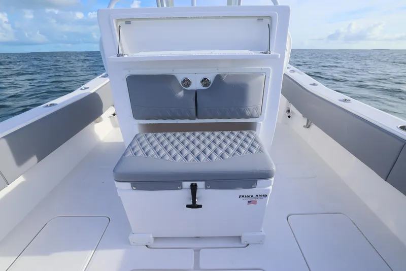 Slide: The Image of 2025 Invincible 33 Open Fisherman boat interior with cushioned seating and ocean view. - 29