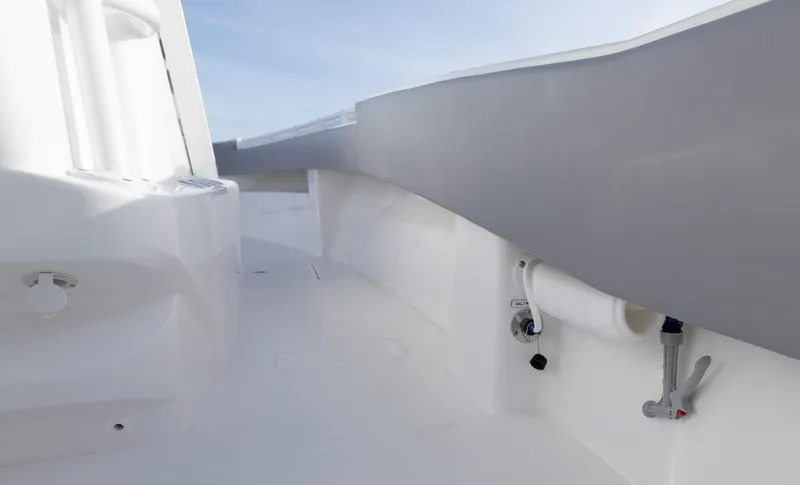 Slide: The Image of 2025 Invincible 33 Open Fisherman boat interior, sleek white and gray design. - 32