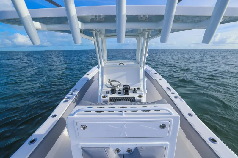 Slide: The Image of 2025 Invincible 33 Open Fisherman boat on open sea, clear sky. - 35