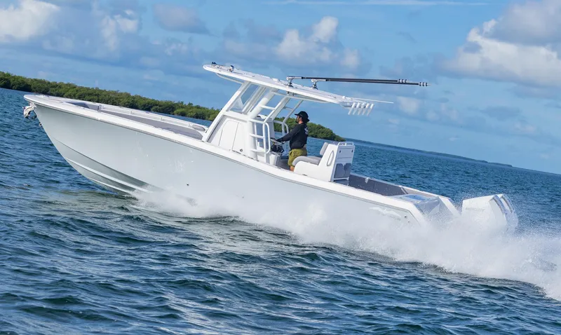 Slide: The Image of 2025 Invincible 33 Open Fisherman boat cruising on open water. - 42