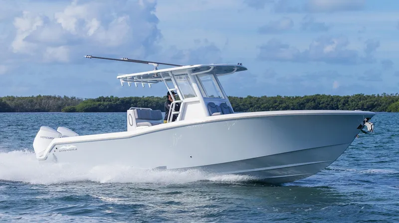 Slide: The Image of 2025 Invincible 33 Open Fisherman boat cruising on open water. - 43