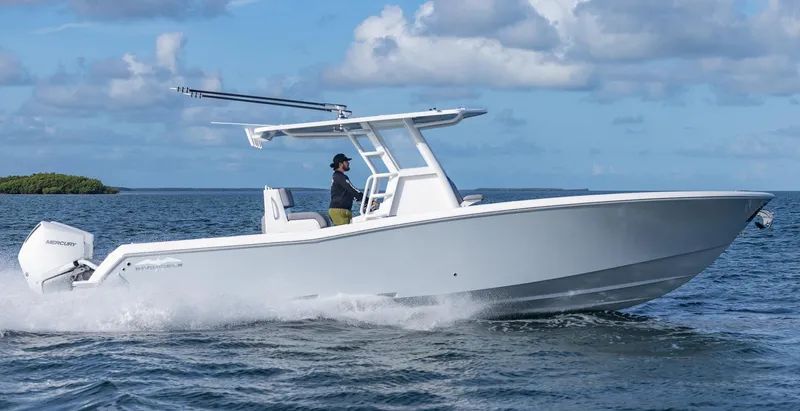 Slide: The Image of 2025 Invincible 33 Open Fisherman boat cruising on the ocean. - 44