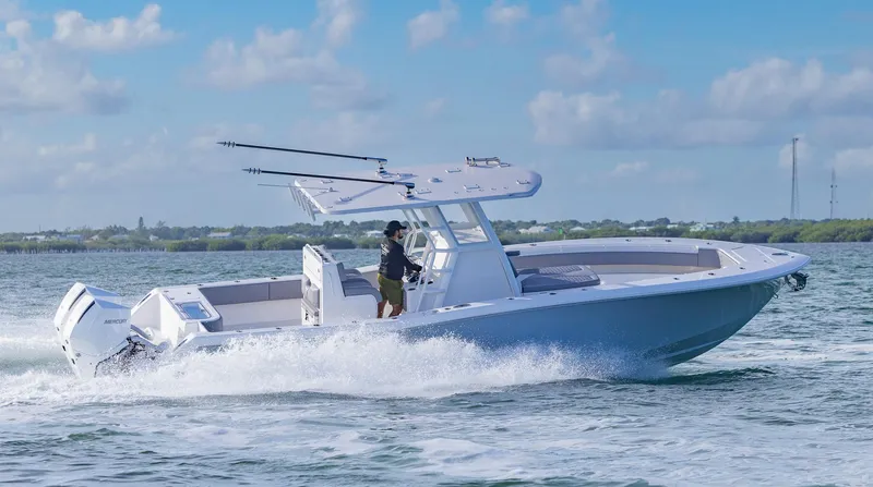 Slide: The Image of 2025 Invincible 33 Open Fisherman boat cruising on open water. - 46