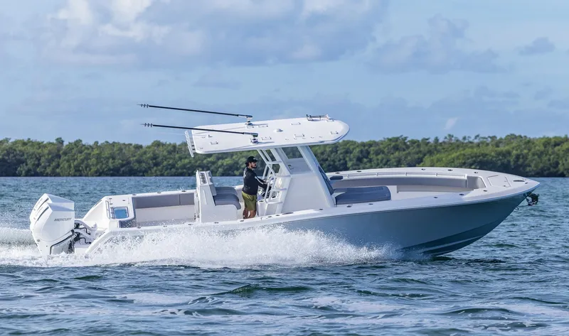 Slide: The Image of 2025 Invincible 33 Open Fisherman boat cruising on water. - 47