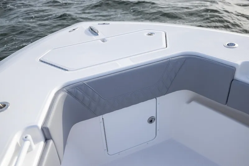 Slide: The Image of 2025 Invincible 33 Open Fisherman boat interior detail with ocean backdrop. - 8