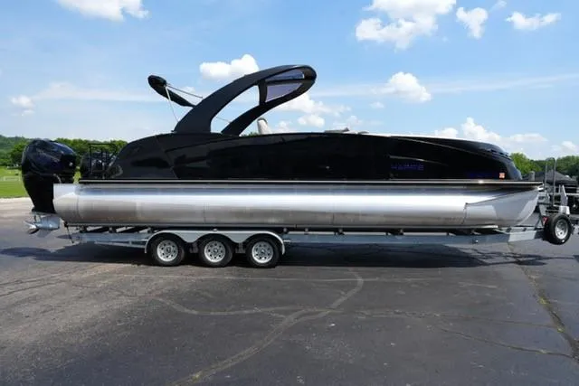 Slide: The Image of 2019 Harris Crowne 270 SL Twin Engine pontoon boat on trailer, parked outdoors. - 3