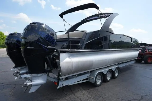 Slide: The Image of 2019 Harris Crowne 270 SL Twin Engine pontoon boat on a trailer. - 4
