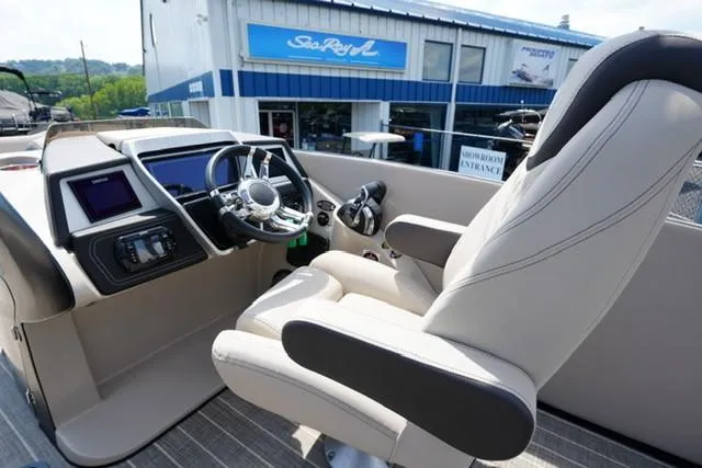 Slide: The Image of Captain's seat and helm of 2019 Harris Crowne 270 SL Twin Engine boat. - 9