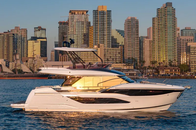 Slide: The Image of 2025 Prestige F4.9 yacht cruising on open water, showcasing sleek design and luxury features. - 1