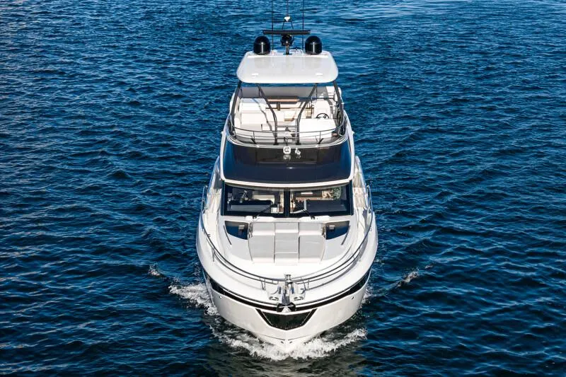 Slide: The Image of Modern kitchen interior of 2025 Prestige F4.9 yacht with sleek wood cabinetry. - 29