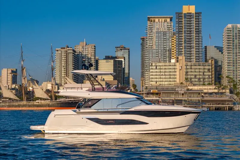 Slide: The Image of Interior of 2025 Prestige F4.9 yacht cockpit with modern controls and leather seating. - 35
