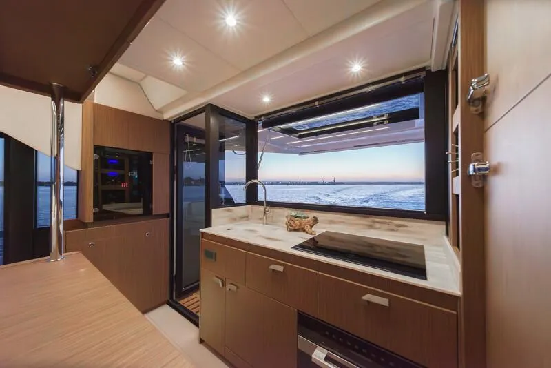 Slide: The Image of Luxury 2025 Prestige F4.9 yacht cruising on open water under clear skies. - 52