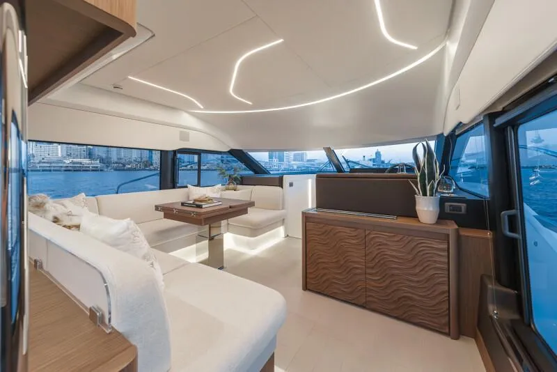 Slide: The Image of Luxury 2025 Prestige F4.9 yacht cruising on open water, aerial view. - 53