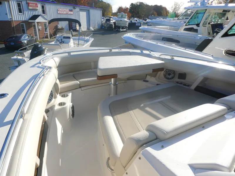 Slide: The Image of 2024 Boston Whaler 350 Realm boat interior with seating and table. - 15