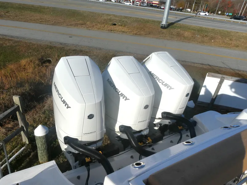 Slide: The Image of 2024 Boston Whaler 350 Realm with triple Mercury outboard engines. - 4