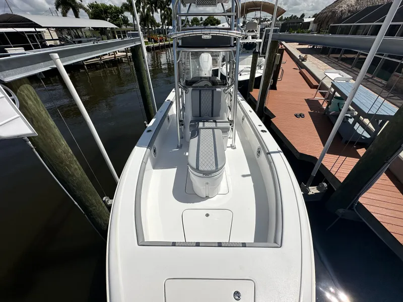 Slide: The Image of 2024 Lake & Bay 25 Open boat docked at marina, top view. - 15