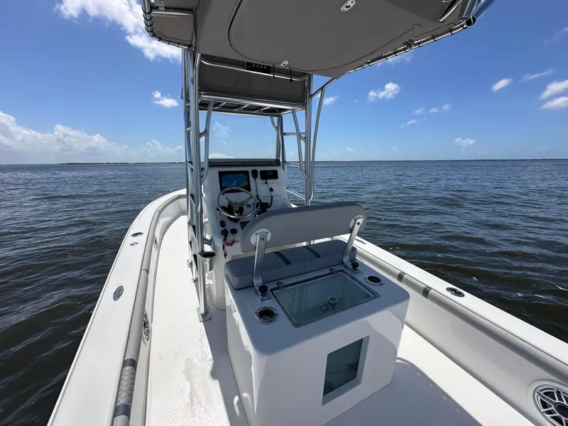 Slide: The Image of 2024 Lake & Bay 25 Open boat on calm waters under clear blue sky. - 19