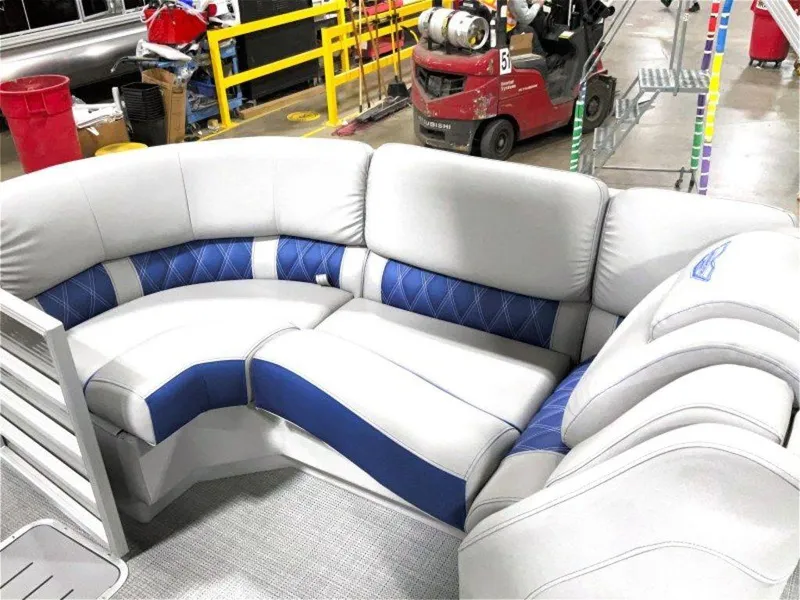 Slide: The Image of 2024 Bennington 25 RSR boat interior with plush gray and blue seating. - 10