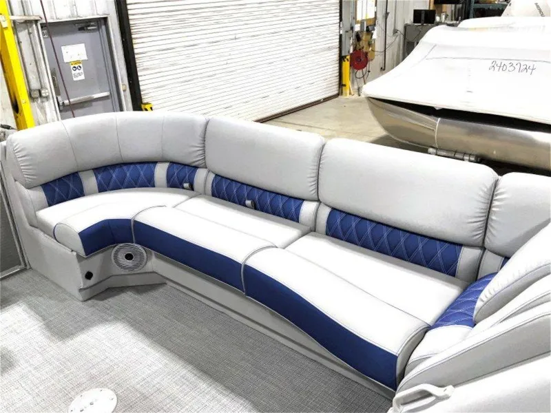 Slide: The Image of 2024 Bennington 25 RSR boat interior with plush gray and blue seating. - 15